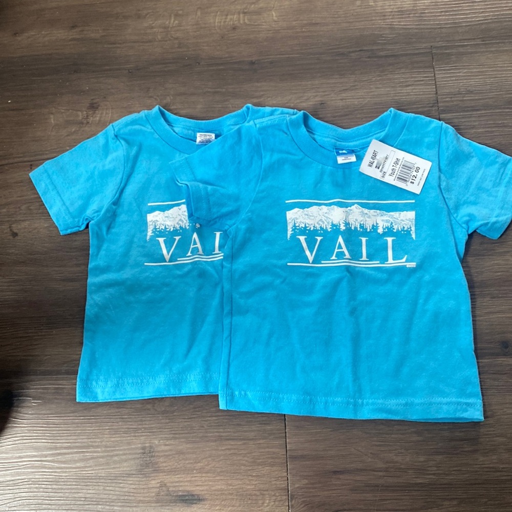 Two brand new shirts from Walmart 6 m has a picture of a mountain and says Vail